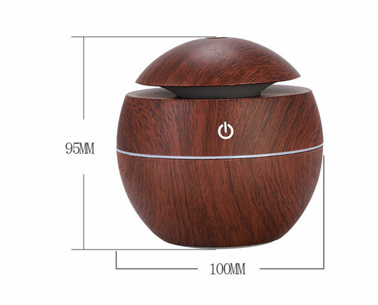 Dark wood grain aroma diffuser and humidifier with a silver power button and accent line. - Image 11