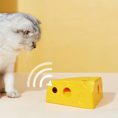 Yellow cheese-shaped electric cat toy with a white feather attachment, shown with three AA batteries and a replacement feather. - Image 9