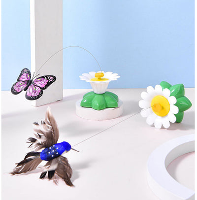 Automatic cat teaser toy with an electric rotating bird on a steel wire, attached to a green and white flower base. - Image 10