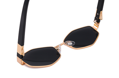Women's hexagonal sunglasses with dark lenses, gold-colored metal frame, black temples, and a detachable gold chain. - Image 24