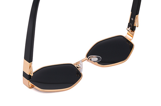 Women's hexagonal sunglasses with dark lenses, gold-colored metal frame, black temples, and a detachable gold chain. - Image 24