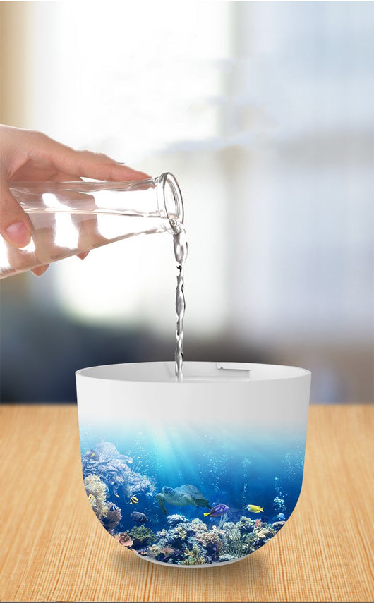 Teal egg-shaped USB humidifier with a glowing blue light band and a 'T' shaped indicator on top. - Image 9