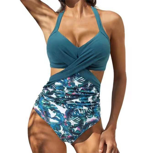Women's teal halter bikini top with a twisted front and high-waisted bottoms featuring a blue and green tropical leaf print. - Image 7