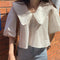 Blusa Crop con Cuello Tipo Solapa y Mangas Puff
