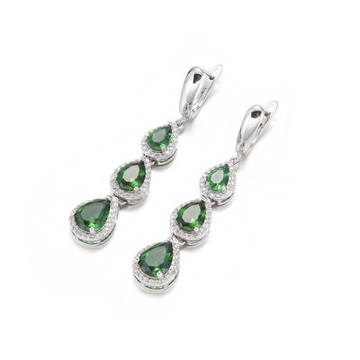 Green pear-shaped gemstone jewelry set with necklace, dangle earrings, ring, and bracelet, all with clear stone accents. - Image 3
