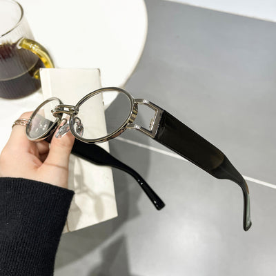 Retro small frame sunglasses with gold round frames and leopard print temples, held by a hand. - Image 10
