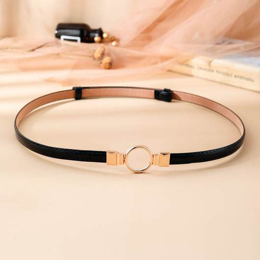 Black imitation leather belt with a glossy finish and a gold-tone round double buckle. - Image 11