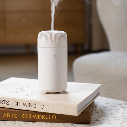 White columnar tabletop water humidifier with a ribbed top and a power button on the front, on a white background. - Image 2
