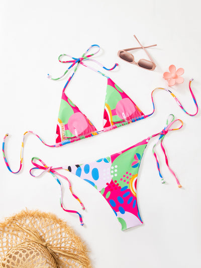 Women's vibrant abstract eye print bikini with triangle top and tie-side bottoms, featuring pink, green, and blue. - Image 5