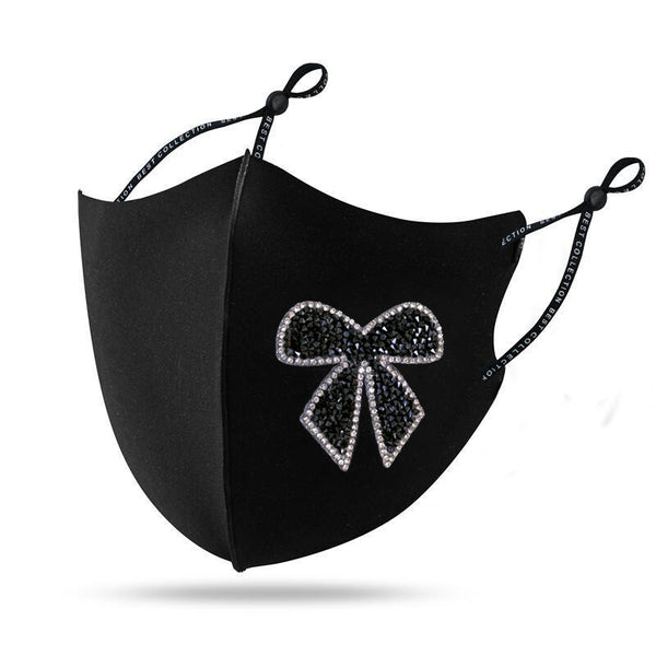 Black cloth face mask with a sparkling red and silver rhinestone bow design and adjustable ear loops. - Image 6