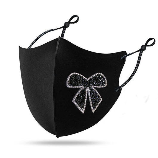 Black cloth face mask with a sparkling red and silver rhinestone bow design and adjustable ear loops. - Image 6