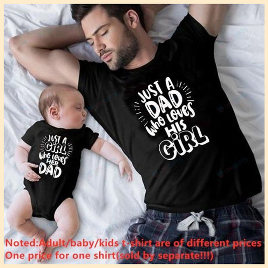 Black cotton t-shirt for dad with pink "JUST A DAD who loves HIS GIRL" text and matching baby onesie.