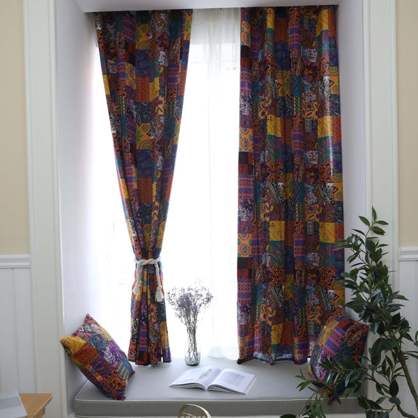 Bohemian retro style cotton linen curtains with a vibrant geometric patchwork pattern, one tied back with a rope.