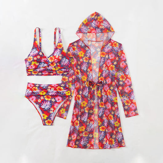Woman in a red multicolor floral print three-piece swimsuit with high-waisted bikini and long-sleeve cover-up, straw hat, and sunglasses on a beach. - Image 15