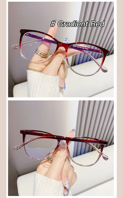 Black full-frame round anti-blue light glasses held by a hand with a gold ring and light blue gradient nails. - Image 16