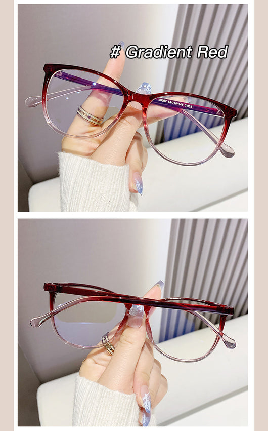 Black full-frame round anti-blue light glasses held by a hand with a gold ring and light blue gradient nails. - Image 16