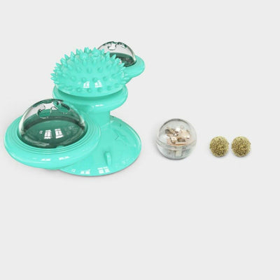 Gray tabby cat playing with a teal windmill cat toy featuring a suction cup base, textured ball, and colorful spinning paddles. - Image 3