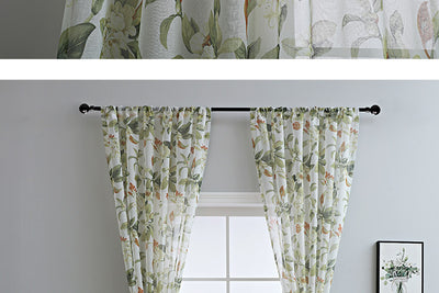 Dark gray semi-sheer curtains with a white and green floral pattern, hung on a black rod in a living room. - Image 22