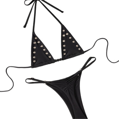 Black tie-front bikini swimsuit with silver grommets on the triangle top and a ruched thong bottom, laid flat. - Image 5