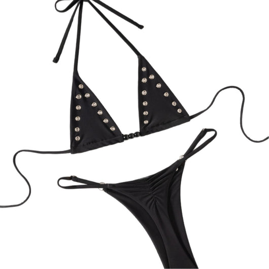 Black tie-front bikini swimsuit with silver grommets on the triangle top and a ruched thong bottom, laid flat. - Image 5