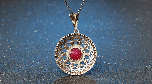 Vintage-style jewelry set with a necklace and matching drop earrings. Features red and clear gemstones in an antique gold-tone filigree design. - Image 8