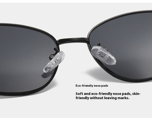Small oval metal sunglasses for women with a gold frame and brown gradient lenses, featuring black temple tips. - Image 10