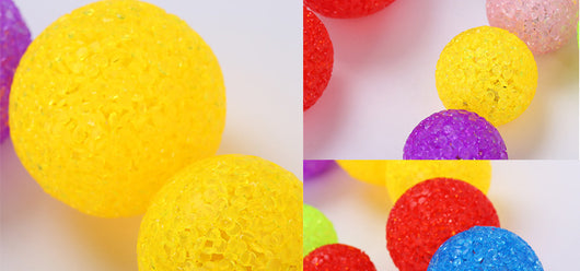 Assortment of colorful textured plastic cat toy balls in red, yellow, blue, purple, pink, and green. - Image 14