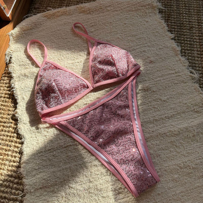 Woman wearing a black sequined triangle bikini top and high-cut bottom on a sunny beach. - Image 22