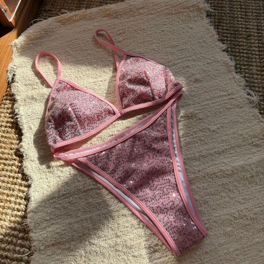 Woman wearing a black sequined triangle bikini top and high-cut bottom on a sunny beach. - Image 22