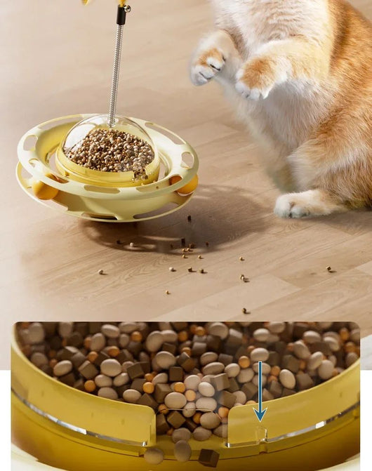 Yellow UFO tumbler cat toy with rolling balls, a clear dome, and a spring-mounted feather wand with a bell. - Image 13