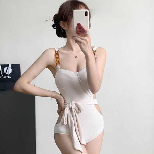 Black ribbed one-piece swimsuit with sweetheart neckline, chain-link shoulder strap, side cut-outs, and self-tie waist. - Image 2
