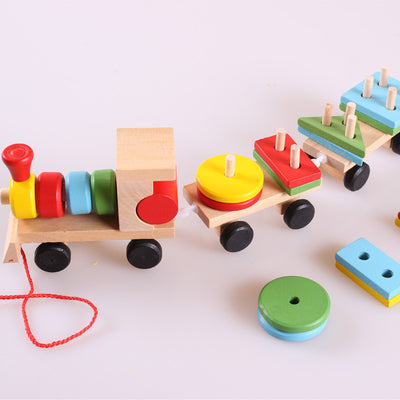 Wooden toy train with a locomotive and two carriages, each carrying colorful shape-sorting blocks. - Image 8
