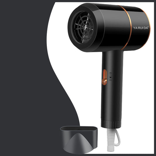 White portable folding hair dryer with rose gold accents and a nozzle attachment, shown with its base.