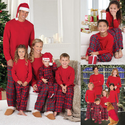 Man wearing a red long-sleeve pajama top and red plaid pajama pants, suitable for Christmas or holiday loungewear.