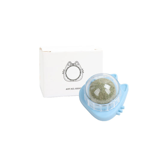 Orange carrot-shaped cat toy with a clear dome holding a rotating catnip ball, next to its white packaging box. - Image 16