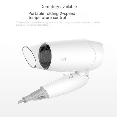 White compact hair dryer with a clear nozzle and control buttons on the handle, ideal for household or travel use. - Image 6