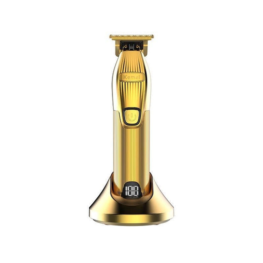 Gold electric hair clipper set with charging base, LCD display, four guide combs, cleaning brush, oil, and USB cable.