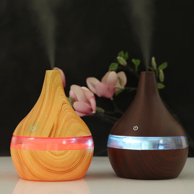 Dark wood grain USB mini tip air purifier and humidifier with a teardrop shape and a silver band. - Image 14