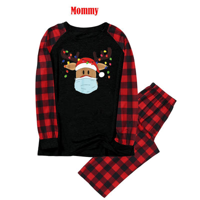 Matching family Christmas pajamas with grey tops, red plaid sleeves, and a reindeer wearing a Santa hat and face mask. - Image 9