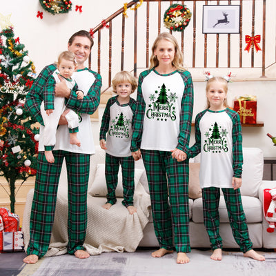 Family of four wearing matching green plaid Christmas pajamas with "Merry Christmas" and Christmas tree print. - Image 9