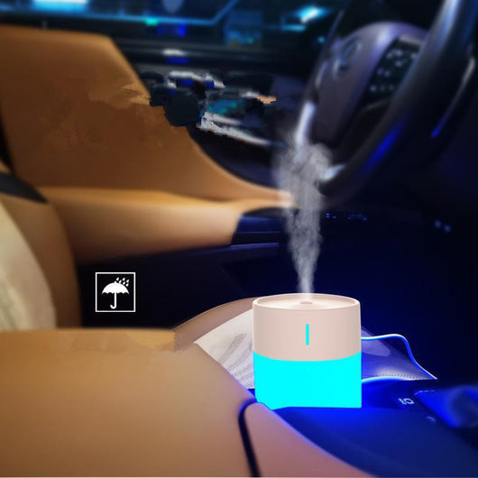 Cylindrical humidifier with a frosted white body and a light pink top, featuring a small mist outlet. - Image 13