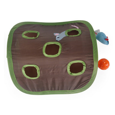 Grey tabby kitten playing with a brown and green hide-and-seek cat toy with multiple holes and a mouse graphic. - Image 6