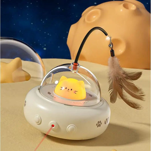 Electric interactive cat toy with a beige base, clear dome, and a cute cat head inside. Features a feather teaser wand with a bell. - Image 9