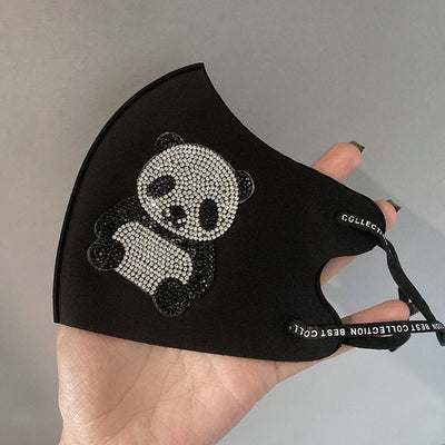 Black ear-mounted mask with a sparkling rhinestone bow pattern, featuring adjustable ear loops. - Image 13