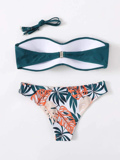 Blue bandeau bikini top with tropical leaf print high-cut bottom, styled with sandals, sunglasses, and a straw hat. - Image 14
