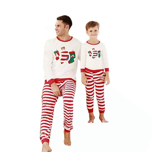 Father and son wearing matching Christmas pajamas with white long-sleeved tops featuring stocking prints and red and white striped pants. - Image 10