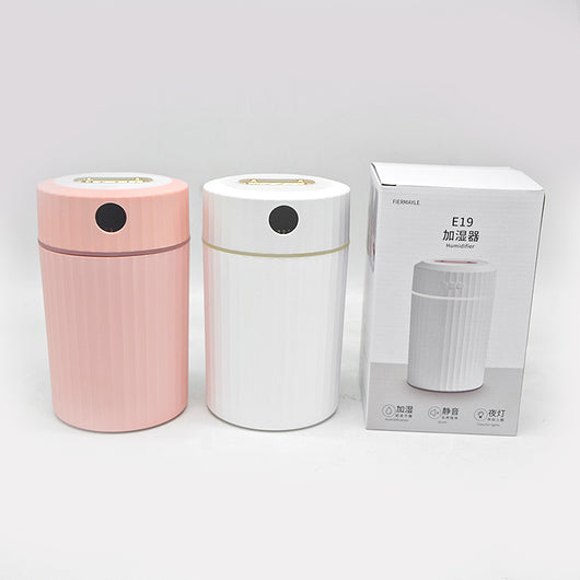 Pink cylindrical humidifier with ribbed texture, digital display showing 59%, and a light blue LED ring. - Image 15