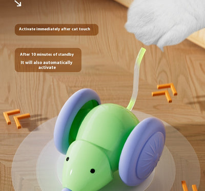 Green and purple electric mouse car cat toy with a glowing tail on a woven mat, designed for interactive play. - Image 15