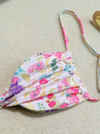 White ribbed two-piece bikini with colorful floral print, featuring a bandeau top and high-cut bottom. - Image 21