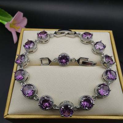 Four-piece silver-tone jewelry set with round green gemstones, including a necklace, bracelet, ring, and dangle earrings. - Image 14